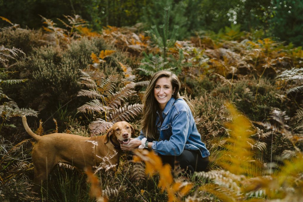 Karen Flower Brand Photography - woman with a Visla dog amongst ferns