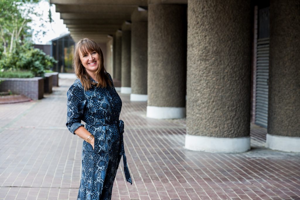 Karen Flower Photography - woman in blue dress in Barbican Centre
